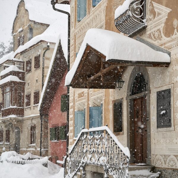 brown and white concrete building covered with snow